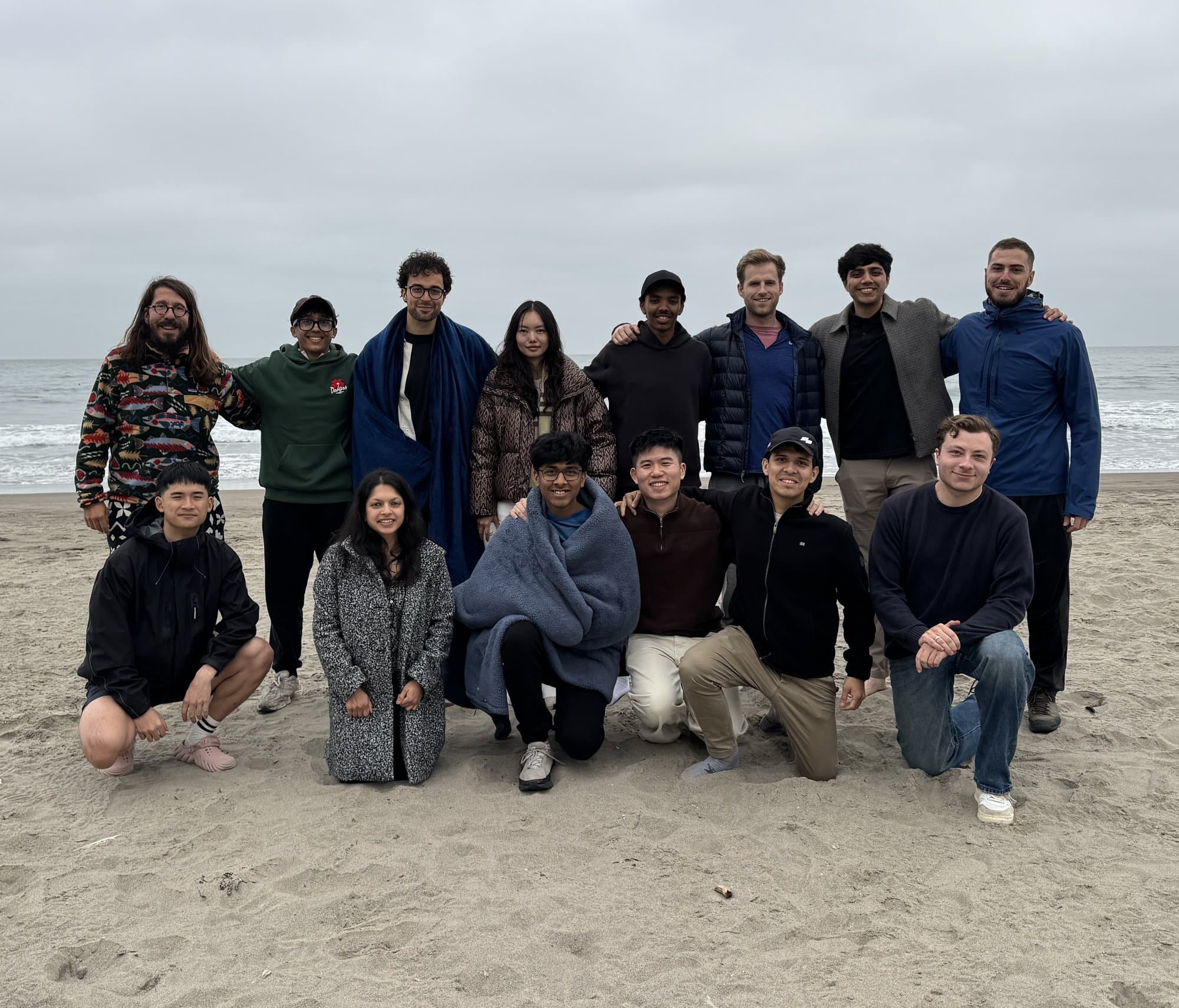 A group photo of a Solo Founders cohort on the beach
